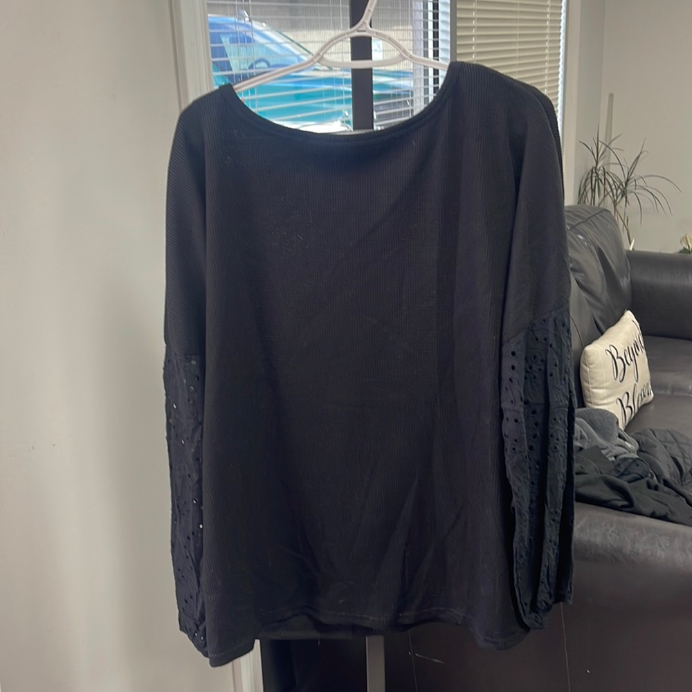 Black sweater, with flower designs on sleeves. brand new!